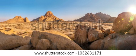 Similar – Image, Stock Photo Beautiful sunrise at Damaraland, Namibia. Group of people seen from their back walking up a mountain.