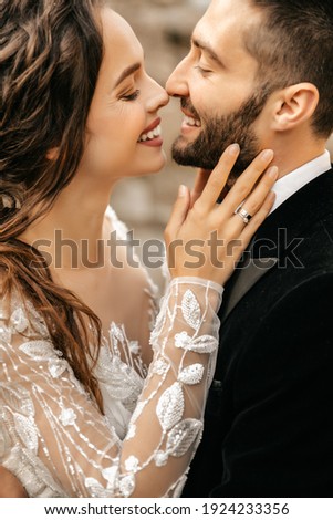 Beautiful wedding couple laugh and kiss on the background of stones. High quality photo ストックフォト © 