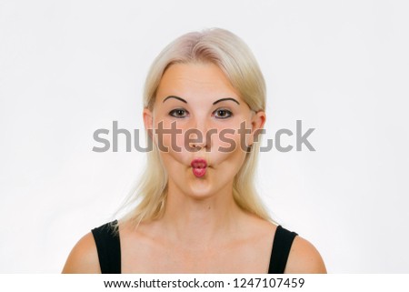 Face exercise fish face, woman makes fish face, girl sucks in her cheeks 商業照片 © 