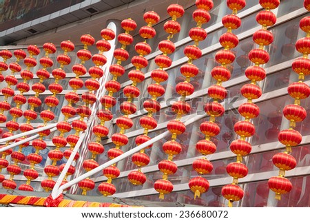 Haikou, China - January 27, 2014: close up of many red lantern hanging on the outside of a building at daytime