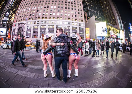 NEW YORK CITY - Jan 22: The Times Square at night on Jan 22, 2015 in New York, Times Square is major commercial intersection in New york and one of the most visited tourist attractions in the world.