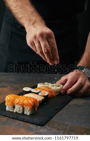 Image, Stock Photo Crop chef preparing sushi at table in restaurant