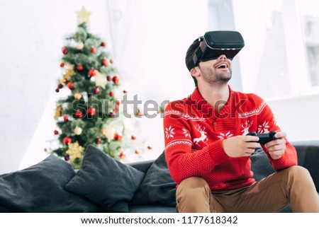 Similar – Image, Stock Photo New reality, xmas tree decorated with face masks