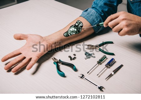 Similar – Image, Stock Photo Crop man fixing microchip in workshop
