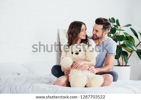 Similar – Image, Stock Photo Happy couple embracing gently in nature