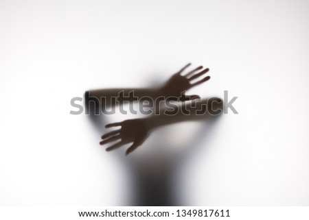 Similar – Image, Stock Photo Anonymous person touching glass of window