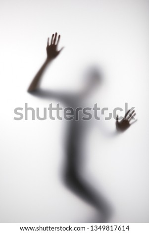 Similar – Image, Stock Photo Anonymous person touching glass of window