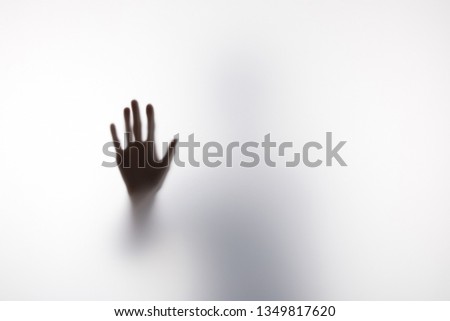 Similar – Image, Stock Photo Anonymous person touching glass of window