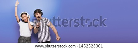 Similar – Image, Stock Photo Cheerful women dancing while listening to music