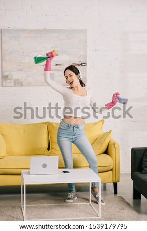 Similar – Image, Stock Photo Cheerful women dancing while listening to music