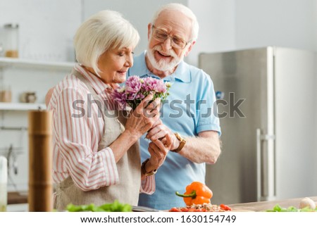 Similar – Image, Stock Photo Senior woman preparing mushrooms