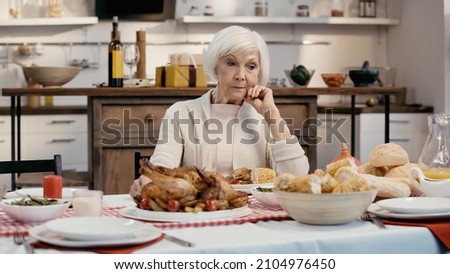 Similar – Image, Stock Photo Bread and dishware near window of countryside dwelling