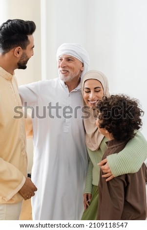 Similar – Image, Stock Photo Pleased woman in turban resting in hammock on terrace