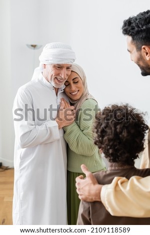 Similar – Image, Stock Photo Pleased woman in turban resting in hammock on terrace