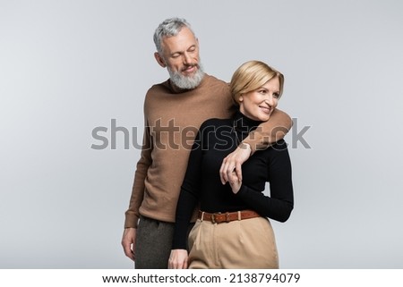Image, Stock Photo Happy family stylish couple with 1 year old child smiling in the park in red and blue clothes