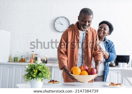 Similar – Image, Stock Photo African-American man smiling near the wall