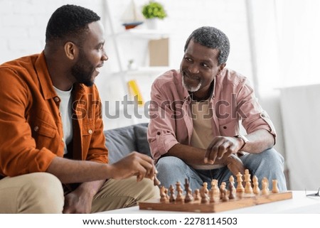 Similar – Image, Stock Photo Man plays chess