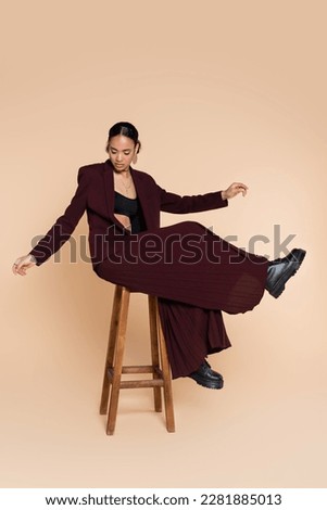 Similar – Image, Stock Photo Young woman posing and looking at camera