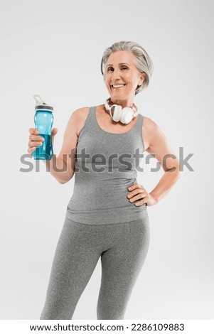 Similar – Image, Stock Photo Senior woman in sportswear jogging through the forest