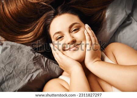 Similar – Image, Stock Photo Curvy woman in bodysuit lying on bed