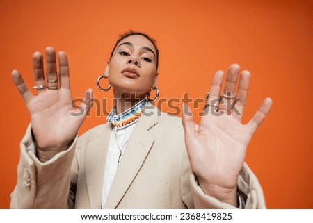 Similar – Image, Stock Photo Stylish black woman in trendy outfit in studio