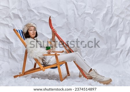 Similar – Image, Stock Photo Traveling woman in outerwear using smartphone in nature