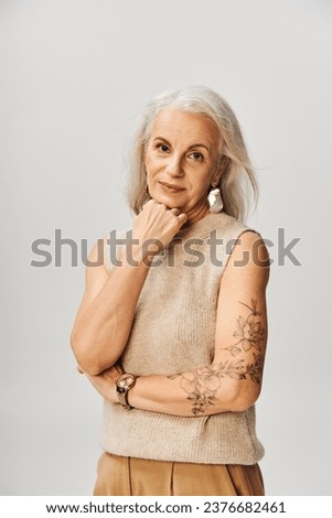 Similar – Image, Stock Photo Confident tattooed woman looking at camera