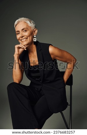 Similar – Image, Stock Photo Gray-haired lady wearing black hat