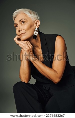 Similar – Image, Stock Photo Gray-haired lady wearing black hat