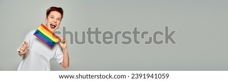 Image, Stock Photo rainbow flag on grey facade