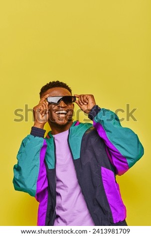 Similar – Image, Stock Photo Urban stylish young man standing by the wall using cellphone