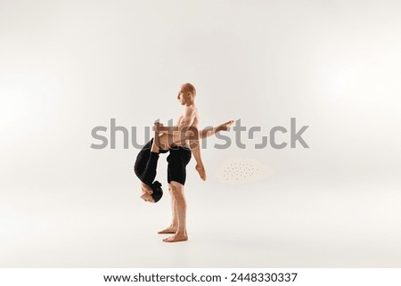 Similar – Image, Stock Photo Woman performing handstand while practicing yoga on street