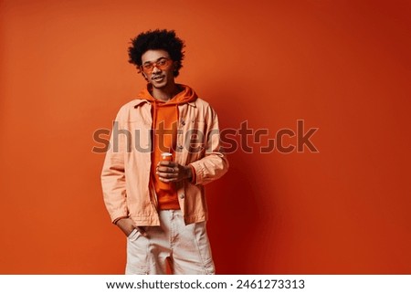 Similar – Image, Stock Photo Urban stylish young man standing by the wall using cellphone