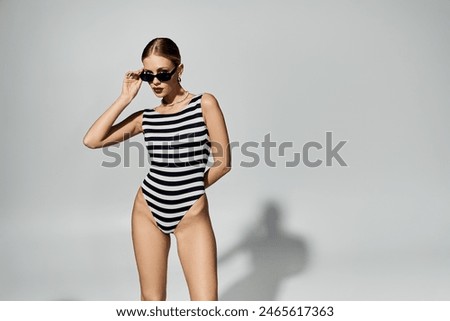 Similar – Image, Stock Photo Appealing female in swimsuit posturing on beach