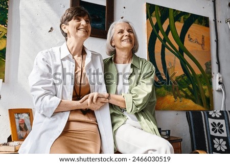 Similar – Image, Stock Photo lesbian couple painting the room walls with white color. Do it yourself and new home concept