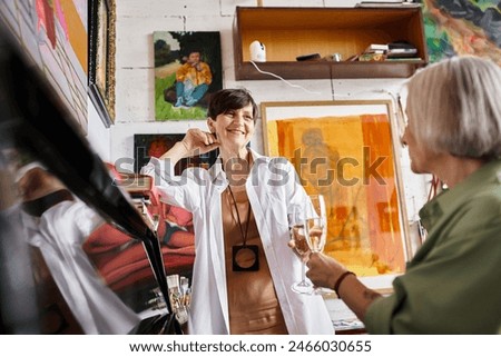 Similar – Image, Stock Photo lesbian couple painting the room walls with white color. Do it yourself and new home concept