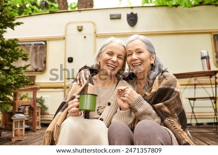 Image, Stock Photo Happy middle aged lesbian couple hugging outdoors