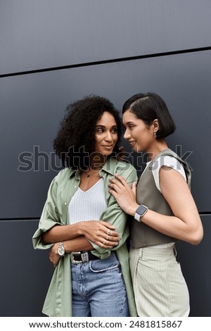 Similar – Image, Stock Photo Delighted black lesbian couple taking selfie on smartphone