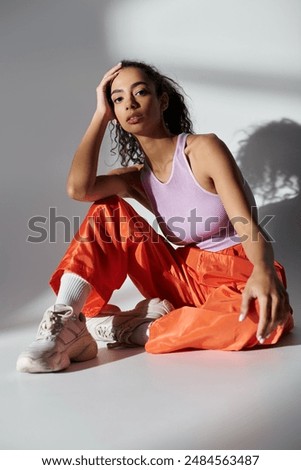 Similar – Image, Stock Photo Young woman posing and looking at camera