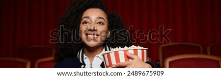 Similar – Image, Stock Photo Focused stylish black woman applying eyeliner at home