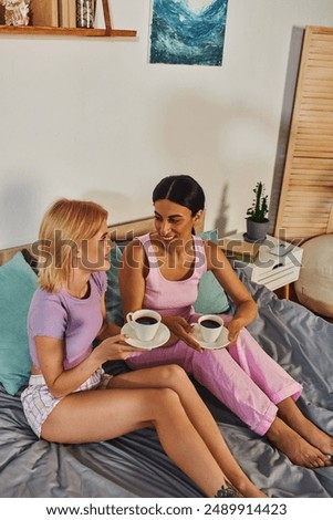 Similar – Image, Stock Photo happy lesbian couple painting the room walls with white color. Do it yourself and new home concept