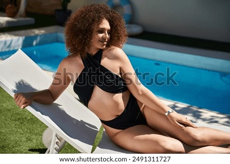 Similar – Image, Stock Photo Model in swimsuit on beach against sea