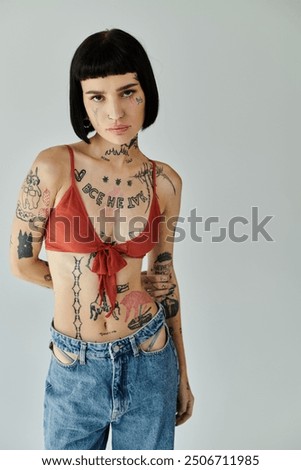 Similar – Image, Stock Photo Confident tattooed woman looking at camera