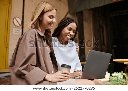 Similar – Image, Stock Photo Delighted black lesbian couple taking selfie on smartphone