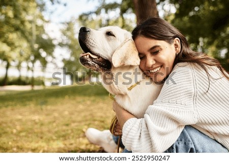 Similar – Image, Stock Photo A happy young woman is sitting in a lotus position and doing yoga on the beach at sunset. The concept of a healthy active lifestyle