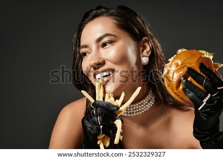 Similar – Image, Stock Photo Black woman enjoying fries and burger in restaurant