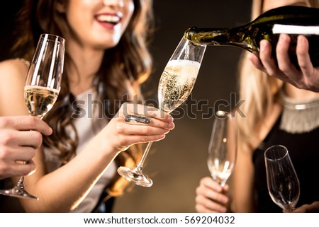 Image, Stock Photo Positive woman pouring champagne in glass