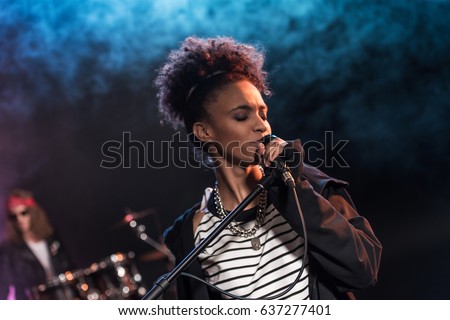 Similar – Foto Bild Ein junger Musiker singt im Regierungsviertel Berlin und zupft auf seiner Gitarre