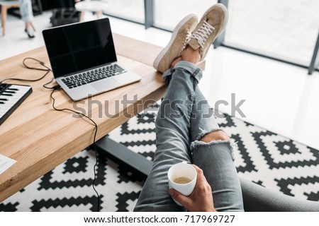 cropped shot of relaxed musician drinking coffee at workplace Zdjęcia stock © 