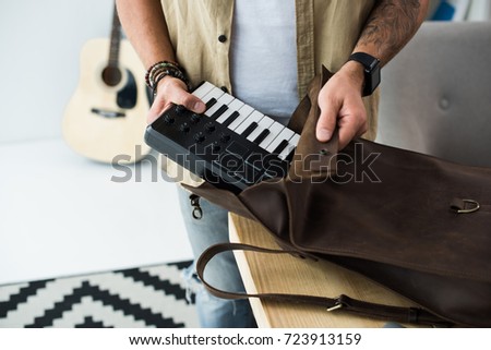 cropped shot of musician putting MPC pad into bag Zdjęcia stock © 
